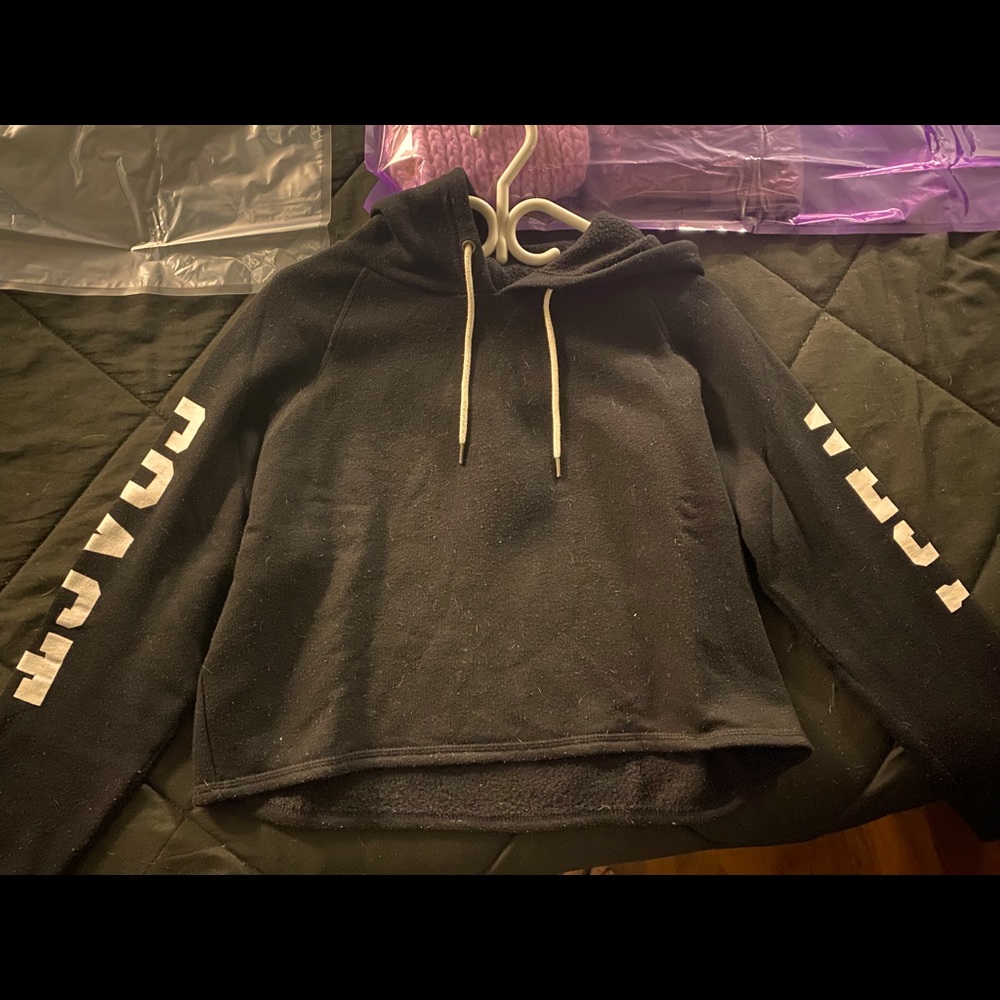 Black crop sweatshirt with west coast written on sleeves